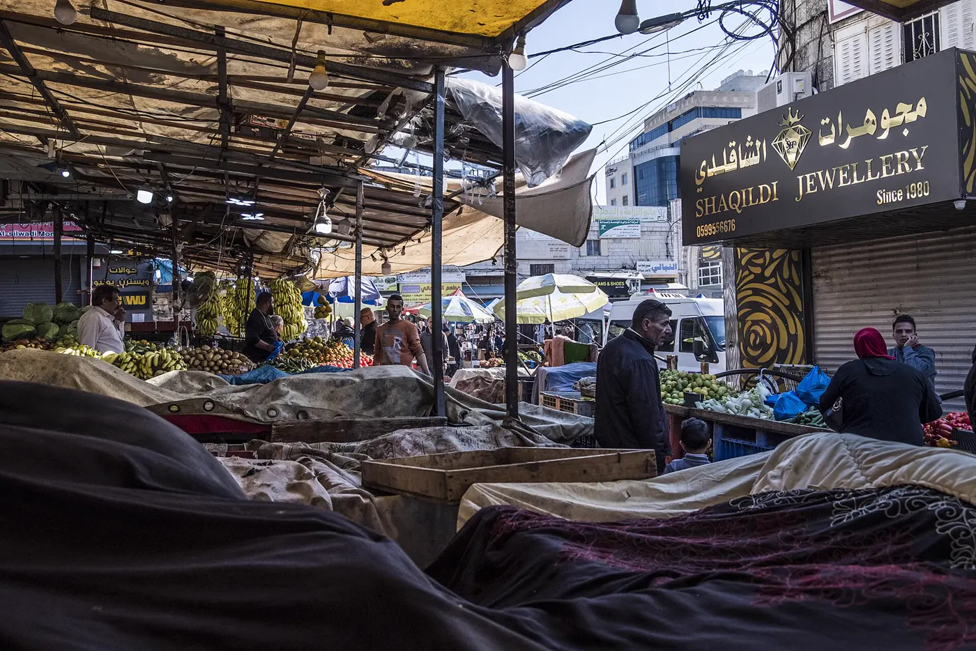 People shopping at a market in Ramallah
